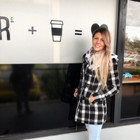 Loz Chai outside cafe after her re-brand project completion 