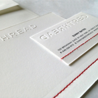 Logo and stationery system for Red Thread