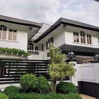 House in a high-end village viewed by a buyer.